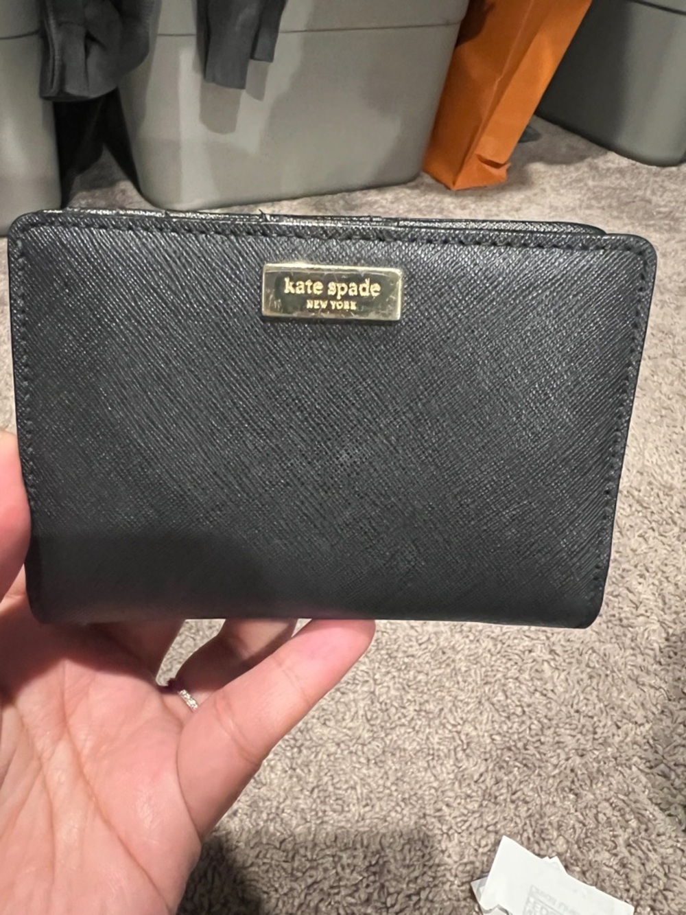 kate spade black Saffiano leather bifold wallet with gold logo plate